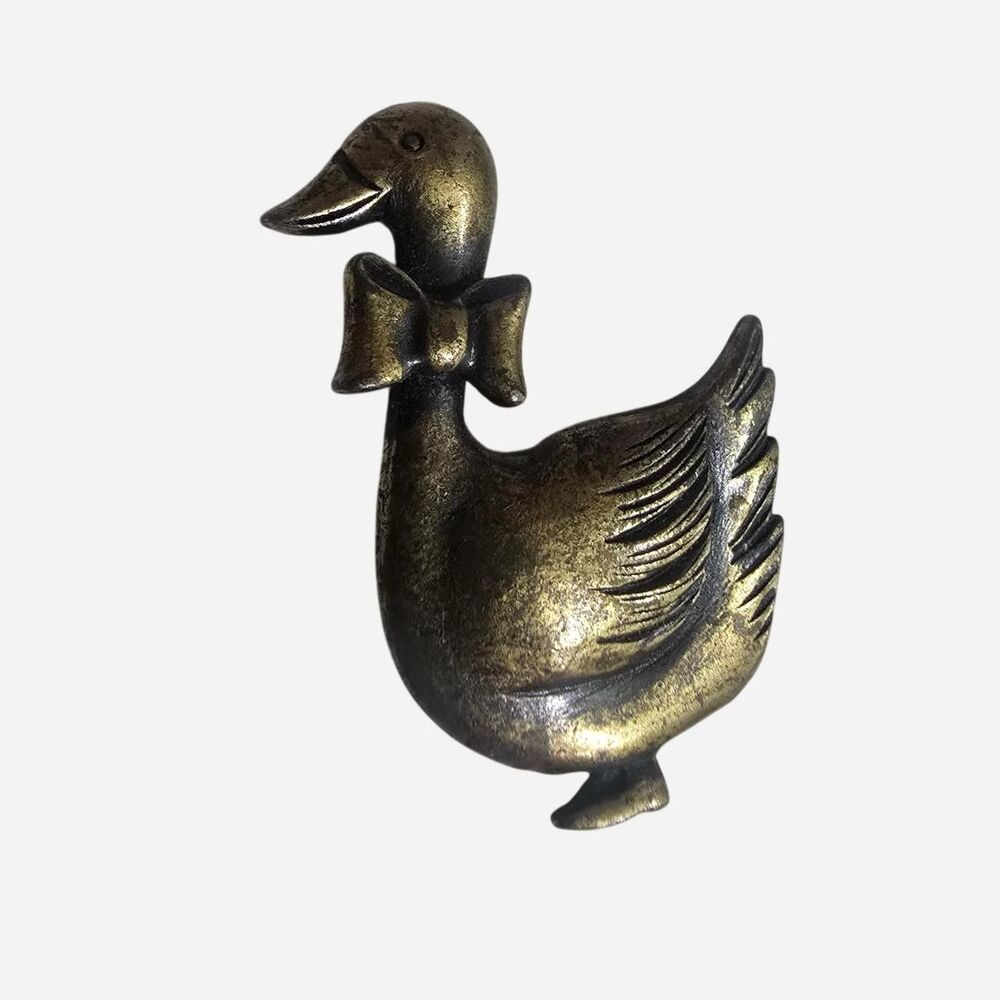 Vintage brass duck brooch with bow
